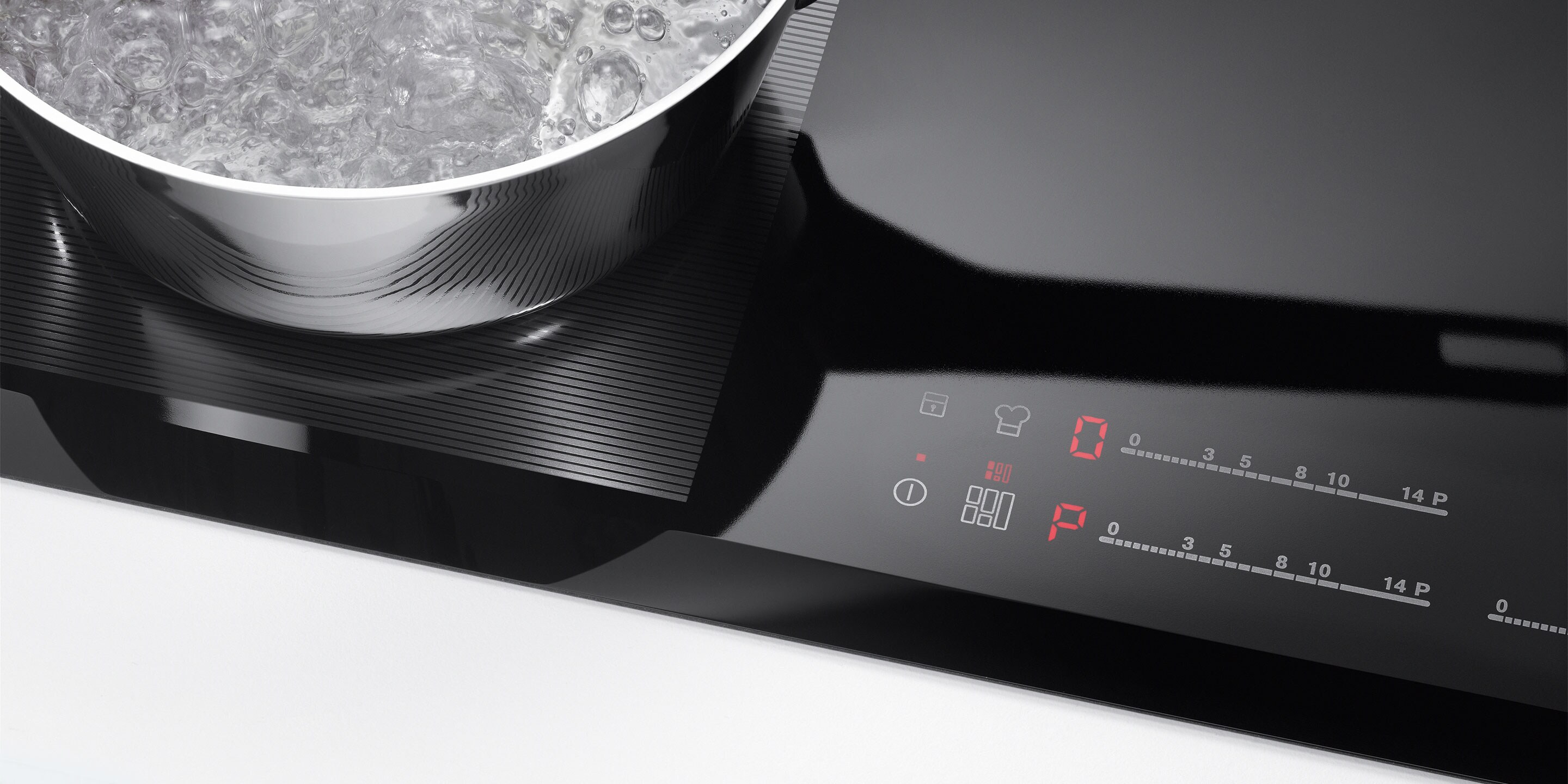 Apstādināšanas un iedarbināšanas taustiņš uz Electrolux indukcijas plīts virsmas