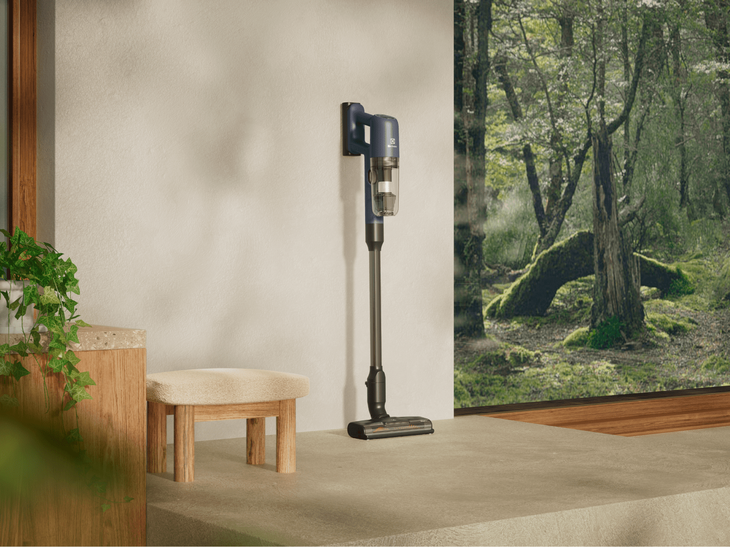 Cordless vacuum cleaner in room next to a window