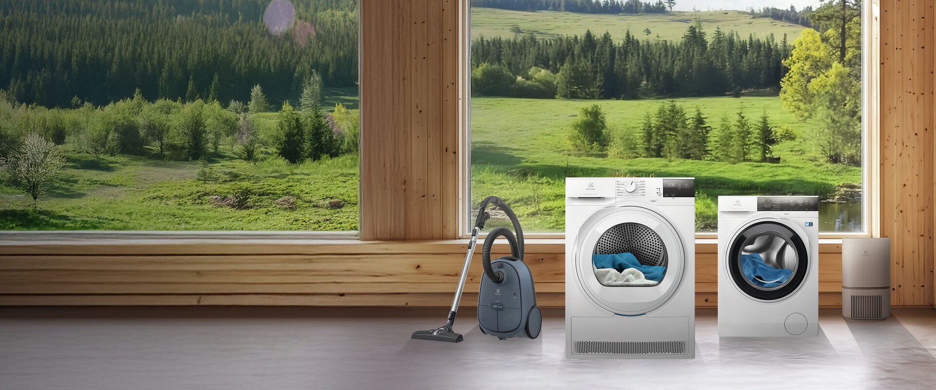 Electrolux sadzīves tehnika pļavu un koku fonā